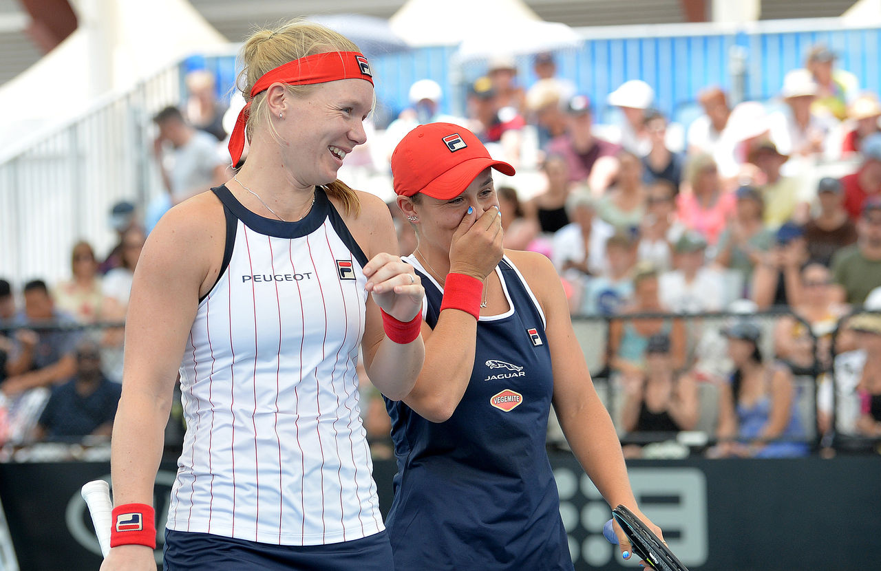 BRISBANE, AUSTRALIA - JANUARY 08: Ashleigh Barty of Australia and Kiki Bertens of the Netherlands share a laugh in their doubles match against Nicole Melichar of the USA and Yifan Xu of China during day three of the 2020 Brisbane International at Pat Rafter Arena on January 08, 2020 in Brisbane, Australia. (Photo by Bradley Kanaris/Getty Images)
