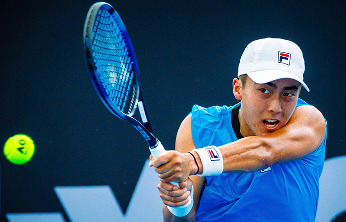 Australia's Rinky Hijikata hits a return against Czech Republic's Tomas Machac during their men's singles match at the Brisbane International tennis tournament in Brisbane on January 4, 2024. (Photo by Patrick HAMILTON / AFP) / --IMAGE RESTRICTED TO EDITORIAL USE - STRICTLY NO COMMERCIAL USE-- (Photo by PATRICK HAMILTON/AFP via Getty Images)