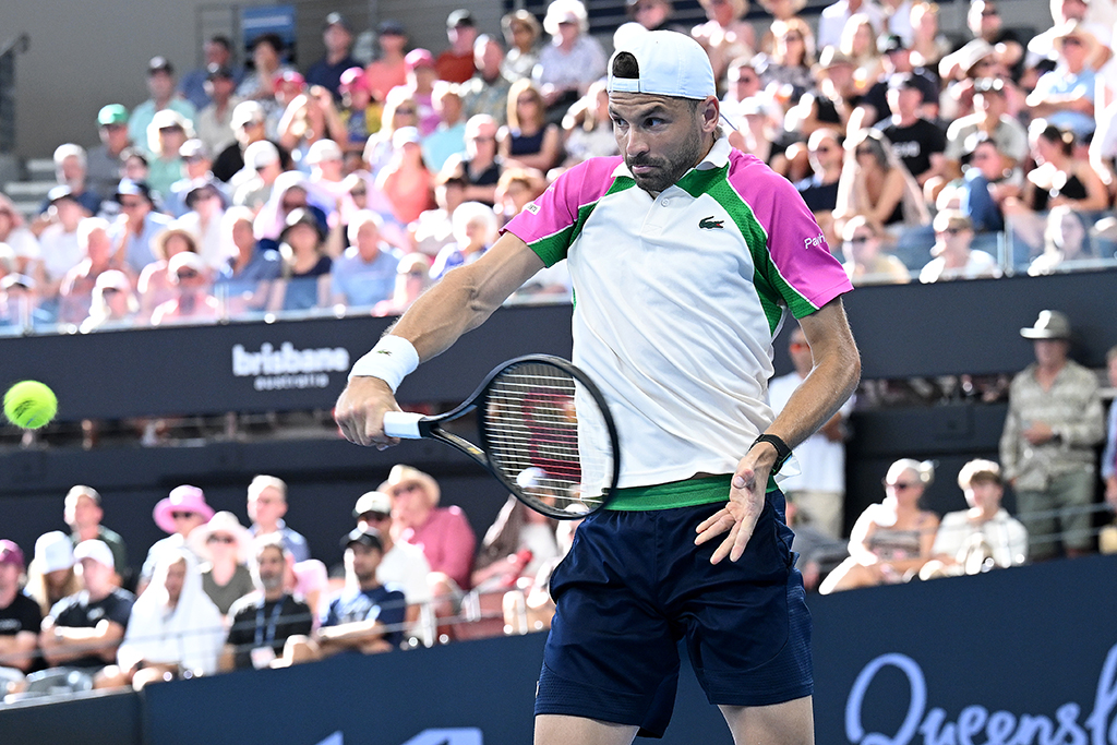 BRISBANE, AUSTRALIA - JANUARY 03: Grigor Dimitrov of Bulgaria plays a backhand in his match against Jordan Thompson of Australia during day six of the 2025 Brisbane International at Pat Rafter Arena on January 03, 2025 in Brisbane, Australia. (Photo by Bradley Kanaris/Getty Images)