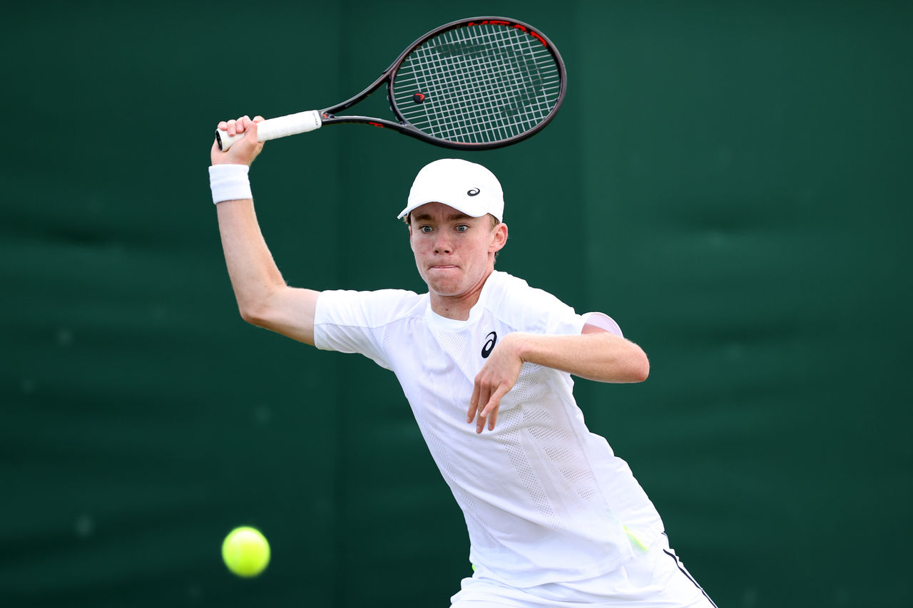 LONDON, ENGLAND - JULY 03: Hayden Jones of Australia plays a forehand against Michael Zheng of United States during their Boys' Singles First Round match on day seven of The Championships Wimbledon 2022 at All England Lawn Tennis and Croquet Club on July 03, 2022 in London, England. (Photo by Ryan Pierse/Getty Images)