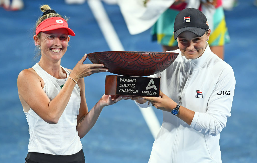 ADELAIDE, AUSTRALIA - JANUARY 09: Storm Sanders and Ashleigh Barty of Australia  with the Womens Doubles Champion Trophy after defeating Darija Jurak Schreiber of Croatia and Andreja Klepac of Slovenia during day eight of the 2022 Adelaide International at Memorial Drive on January 09, 2022 in Adelaide, Australia. (Photo by Mark Brake/Getty Images)