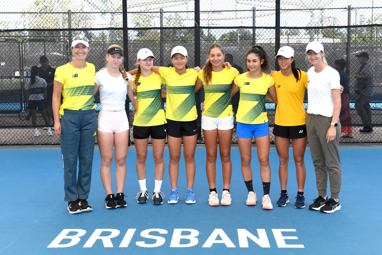 April 10: (Left to right) Junior Australian tennis players Genevieve Lorbergs (Coach), Vesna Marinkov, Jennifer Ott, Emilie Chen, Jizelle Sinai, Renee Alame, Koharu Nishikawa and Jess Moore (Coach) pose for a photograph during a practice session for the Billie Jean King Cup Qualifier at the Queensland Tennis Centre in Brisbane on Wednesday, April 10, 2024. Photo by TENNIS AUSTRALIA/ SCOTT DAVIS