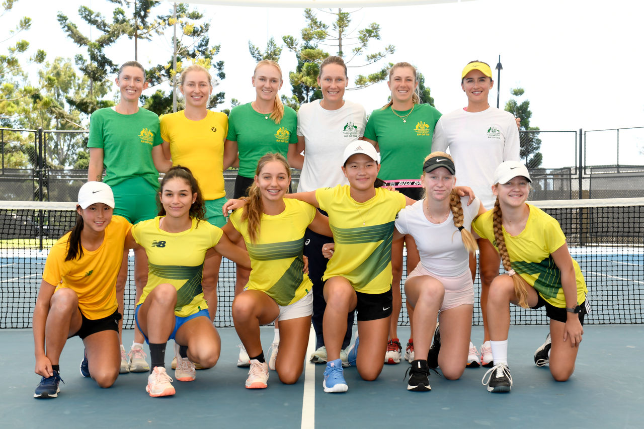 April 10: (Front row Left to right) Junior Australian tennis players Koharu Nishikawa, Renee Alame, Jizelle Sinai, Emilie Chen, Vesna Marinkov,  Jennifer Ott, and pose for a photo with Australian players (back row left to right) Storm Hunter, Daria Saville, Taylah Preston, Sam Stosur, Ellen Perez and Arina Rodionova during a practice session for the Billie Jean King Cup Qualifier at the Queensland Tennis Centre in Brisbane on Wednesday, April 10, 2024. Photo by TENNIS AUSTRALIA/ SCOTT DAVIS