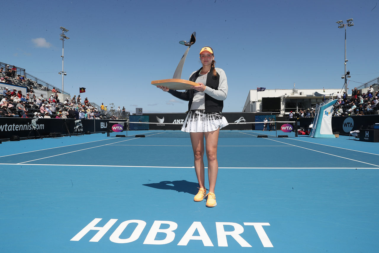 HOBART, AUSTRALIA - JANUARY 18: Elena Rybakina of Kazakhstan poses with the Hobart International trophy after winning her final singles match against Zhang Shuai of China during day eight of the 2020 Hobart International at Domain Tennis Centre on January 18, 2020 in Hobart, Australia. (Photo by Mark Metcalfe/Getty Images)